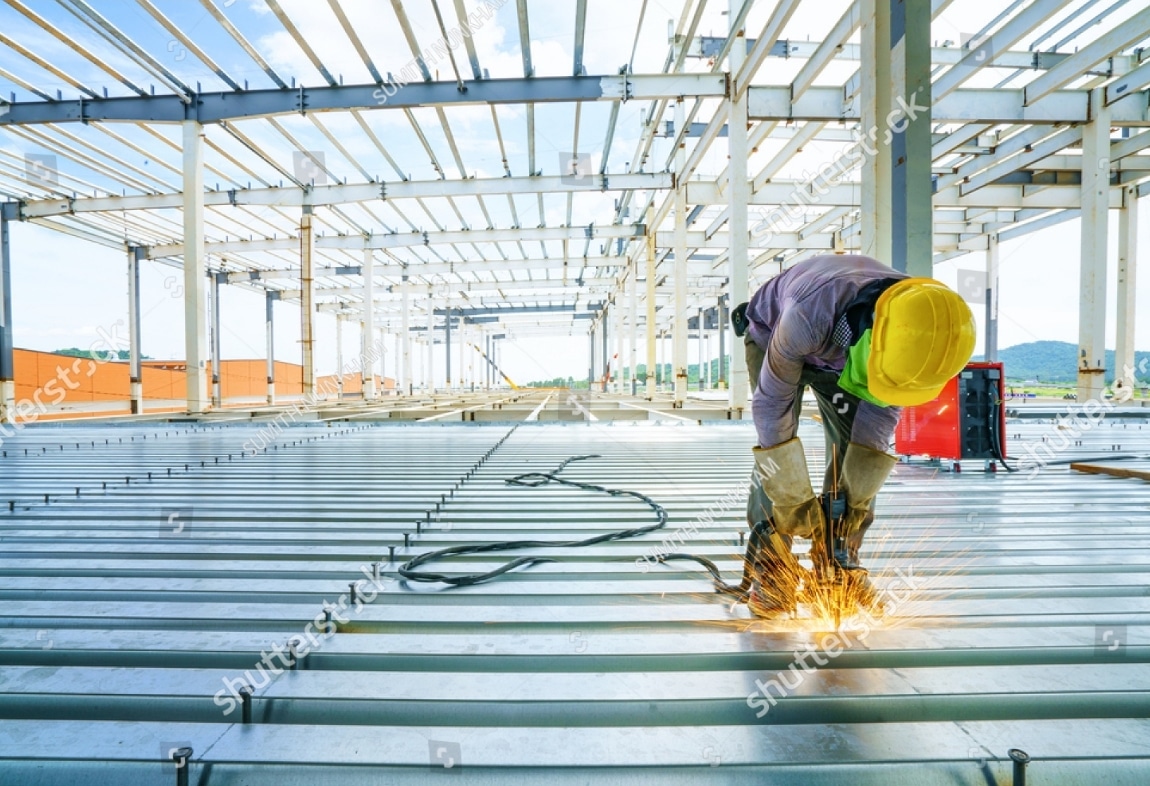 Construction worker on steel metal building